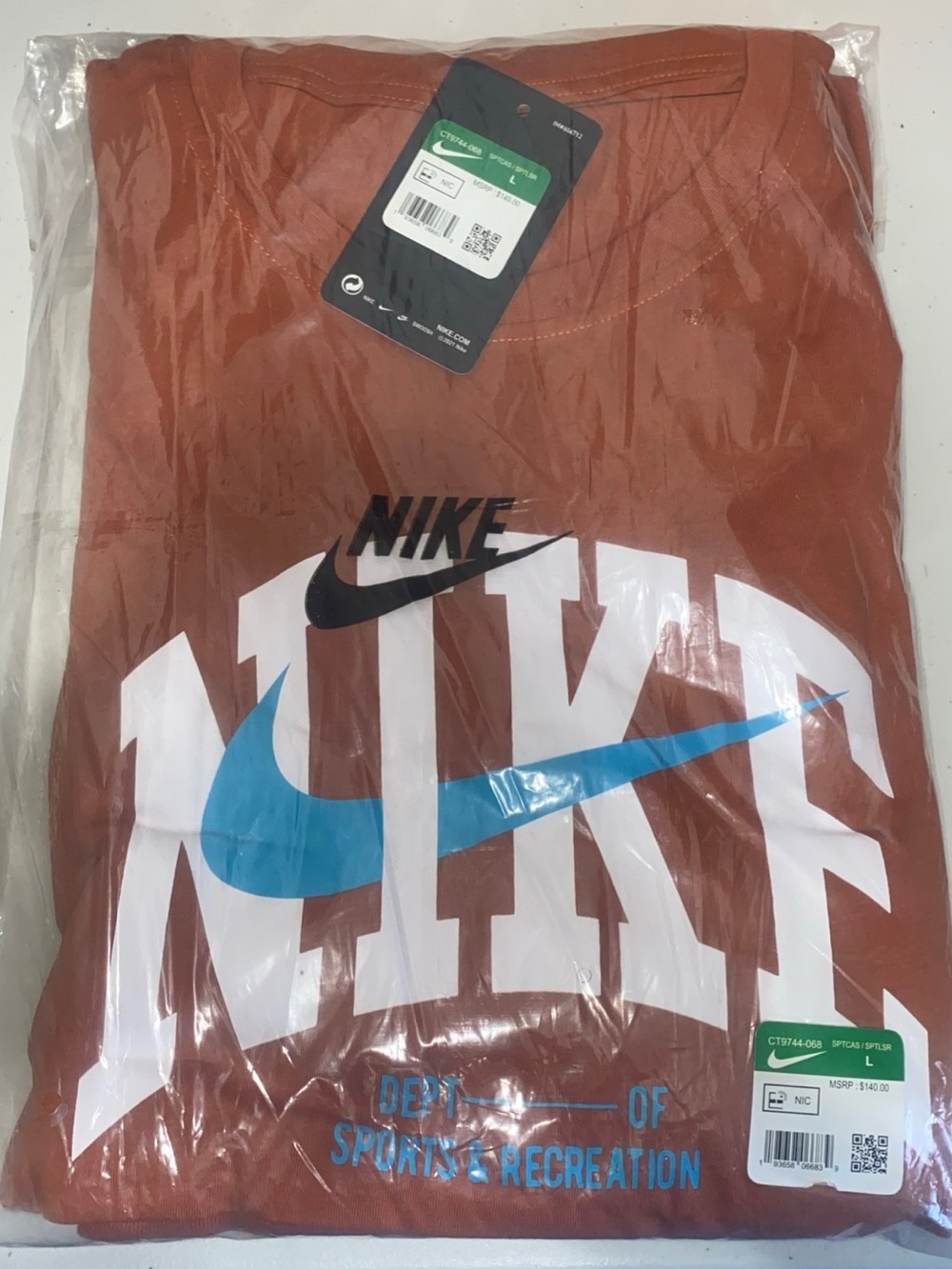 Nike Rust Graphic Tee with White, Black & Blue Logo